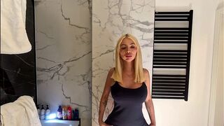 Big tits big ass hot sexy beauty in the bathroom with the short pink skirt shows her braless boobs and long legs