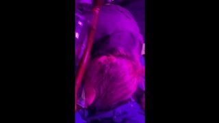 Part 1 of Wife giving trucker head int he truck under purple glow.