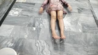 Indian Married Couple Enjoying a Playful Water Moment Together at Home
