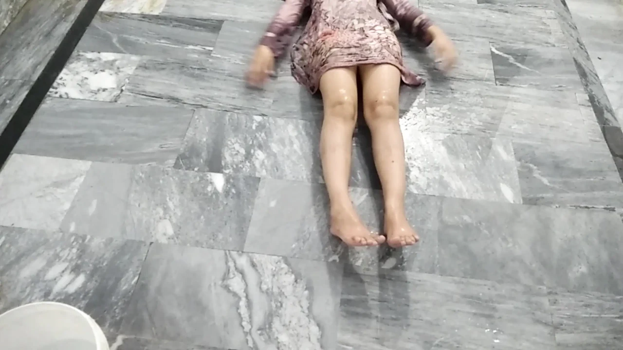 Indian Married Couple Enjoying a Playful Water Moment Together at Home