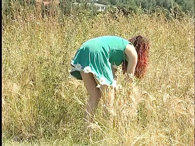 Busty redhead teen lifting dress outdoors
