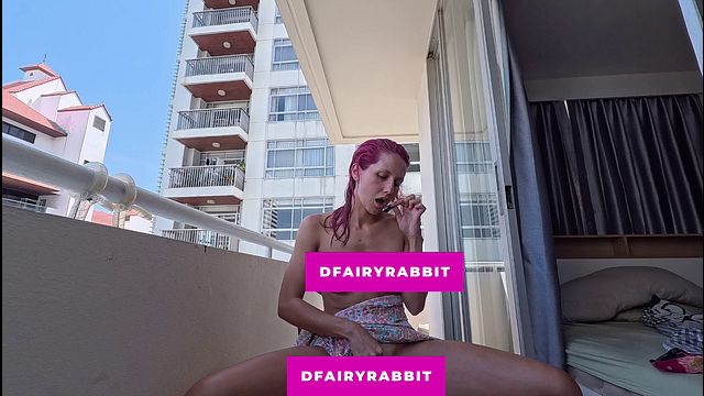 stripping and playing on the balcony... i hope the neighbors are watching me