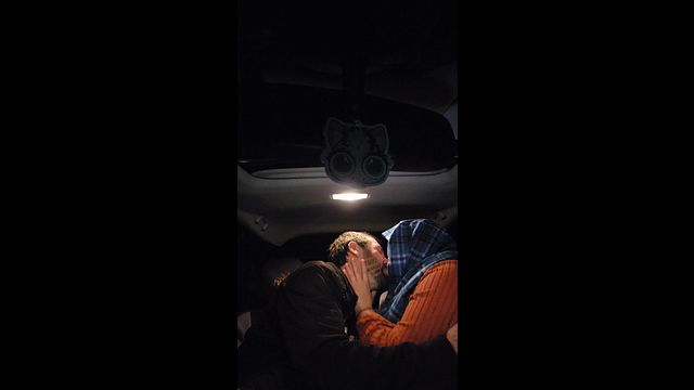 Couple Kissing in the Car