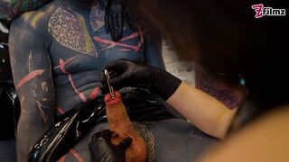 Latex Dominatrix Trio Sound & Finger the Tattooed Slave’s Cock