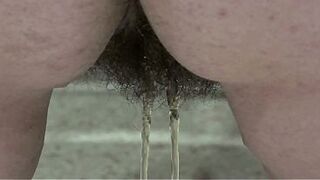 Big pissing doggy style. A BBW with a big ass and a hairy cunt urinates.