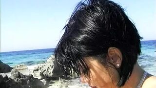 A hot German chick gets double penetrated on the beach