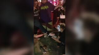 Clown Having Some Feet On His Face
