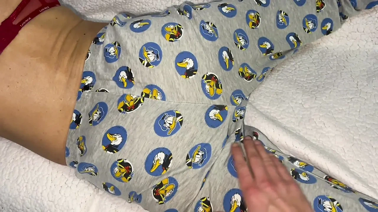 Stepmom was lying reading a book and helped to cum on her hot elastic ass